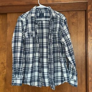 Plaid button down shirt.